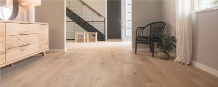Light wood flooring flowing naturally from one room to another | Direct Carpet Unlimited